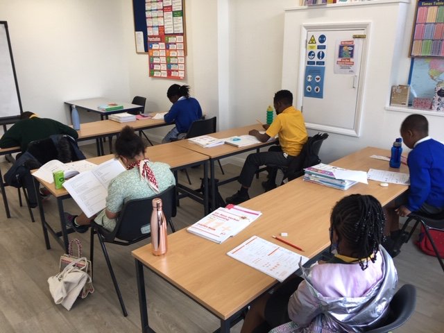 Secondary students working through past papers at Firm Foundation Centre